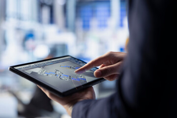Poster - photovoltaics factory expert using tablet to do performance testing of solar panel designs. worker i