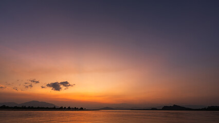 Wall Mural - horizon sea sky background, sunset sky clouds over sea in the morning with orange, yellow sunrise go