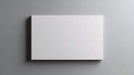 Poster - Empty White Canvas on Gray Office Wall for Creative Use
