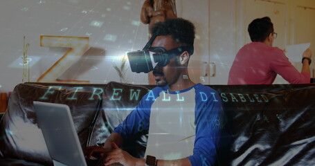 Poster - Man using VR headset and laptop on couch, exploring virtual reality technology