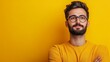 © Konikon Graphic - Studio Portrait of a Pensive Young Man with Glasses Against a Yellow Background