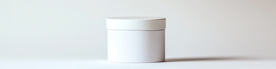 Poster - minimalistic mockup of white round tin with removable lid positioned upright on pristine white background