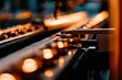 © Kativo - Automated assembly line with orange bottles moving, against a blurred background