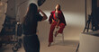 © BuyOutFelix01/peopleimages.com - Photoshoot, photographer and model on set, fashion and pictures for magazine in studio and production. Backstage, creative and tech for project in media agency, camera and equipment for photography