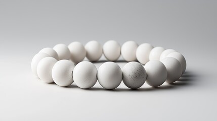 Poster - Minimalist white beaded bracelet on plain background