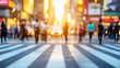 © พงศ์พล วันดี - Busy city street crossing at sunset with people walking and warm light creating a vibrant atmosphere