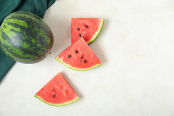 Wall Mural - Whole ripe watermelon and pieces on light background