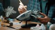 © Artyom - Man painting model spaceship, hobby, creativity, detail work