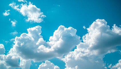 Wall Mural - fluffy white clouds in bright blue sky