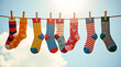 © Olia - A beautiful, bright photo of different socks hanging in a row, embracing uniqueness and World Down Syndrome Day