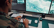 © DavidL25/peopleimages.com - Man, army and typing with computer screen in control room, military battle and monitoring war. Soldier, feedback and global surveillance of satellite warning, government protection and secret service
