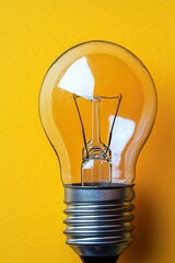 Poster - Isolated Bright Light Bulb On A Yellow Background, Concept For Business, Innovation, Idea