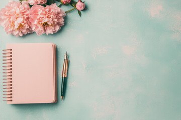 Poster - A quiet and refined scene: peonies resting on an open journal with a fountain pen and soft pink