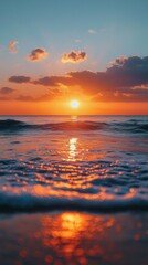 Aufkleber - As daylight fades, the sun casts stunning hues of orange and pink across the sky, reflecting beautifully on the gentle waves rolling onto the shore, creating a peaceful atmosphere