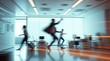 © Jarvis - Blurred figures racing through an office space at rapid speed