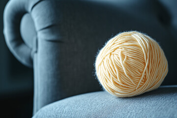 Aufkleber - Pale yellow yarn ball on gray fabric, showcasing texture and softness, representing warmth, comfort and handmade craft