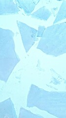 Aufkleber - Super slow motion of falling piece of ice on blue background. Filmed on high speed cinema camera, 1000 fps. Vertical aspect ratio.