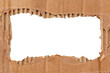 © Gudman - Hole in cardboard. A torn piece of cardboard or paper. Blank space for text