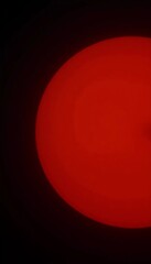 Poster - A brilliant red sun hangs low on the horizon, casting an enchanting glow against a dark, moody sky. The calmness of nature invites peaceful reflection Generative AI