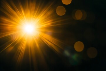 Poster - Bright golden light burst on black background with bokeh.