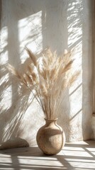 Poster - Sunlight streams through the windows, casting playful shadows on a textured wall. A rustic vase holds wispy pampas grass, creating a serene and inviting atmosphere in the room