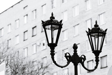 Poster - A single street light illuminates the dark night scene.