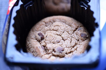 Poster - Freshly baked cookie in a muffin tin, perfect for snack or dessert.