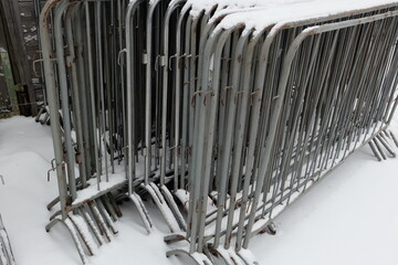 Poster - Winter scene with metal fence posts buried under snow.