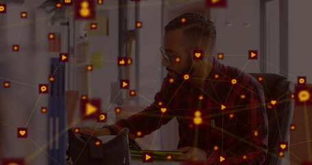 Poster - Man in office using tablet surrounded by digital interface icons and connections