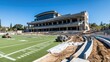 © rawdesign - University Stadium Under Construction: A Glimpse of Modern Athletic Architecture
