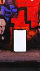 Poster - Blank screen phone against graffiti wall. Modern mobile device for app or website mock-up.