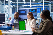 © DC Studio - Photovoltaics factory technicians using isolated screen tablet to improve solar panels efficiency. Solar panels manufacturing plant coworkers researching sustainable solar solutions using mockup