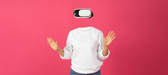Poster - A person wearing virtual reality goggles stands with hands raised, immersed in a digital experience. The bright pink background enhances the focus on the headset and user interaction.