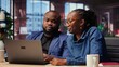 © DC Studio - Black freelancers team at home desk using laptop and checking emails, reading messages in inbox and solving their daily tasks. Couple managing electronic correspondence. Camera B.