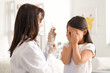© Pixel-Shot - Scared little Asian girl receiving vaccine at hospital