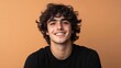 © Daphne - Smiling young caucasian male against orange background