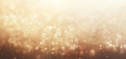 Abstract gold background with bokeh lights.