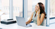 © peopleimages.com - Woman, phone call and smile with laptop, creative editor and research or planning in office. Female copywriter, computer and discussion for project in company, review or workplace administration