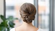 © michnik101 - Elegant woman with styled hair from behind indoors. beauty and preparation