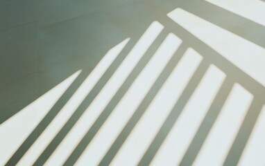 Poster - Abstract image of sunlight casting parallel lines and shadows on a light gray textured surface. The shadows create a geometric pattern