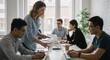 © Margarita Ratatosk - Diverse team collaborating in modern office. Woman leading project discussion with colleagues. Workplace diversity, teamwork, and leadership concept. Business meeting scene.
