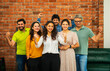 © StockImageFactory - Confident Indian  Asian business team in casuals, smiling, celebrating success in modern workspace