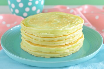 Aufkleber - Fluffy pancakes stacked on a turquoise plate with a pastel background near a polka dot mug