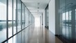 © Nutchapol - Modern hallway with glass walls and polished floors.