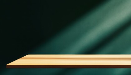 Poster - Empty Light Brown Wooden Shelf Against a Dark Teal Wall with Sunlight