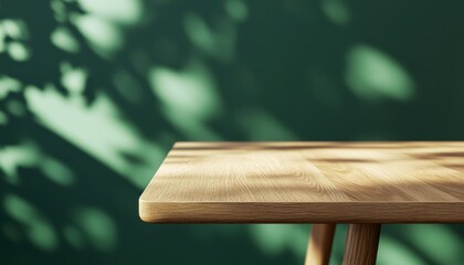 Poster - Rustic Wooden Table Against a Green Wall with Leaf Shadows