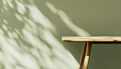 Poster - Small Wooden Table Against Sage Green Wall with Leaf Shadows