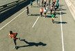© Jacob Lund - Male runner leading a group marathon on city street