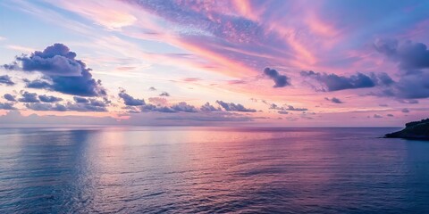 Poster - Vibrant sunset over calm ocean waters with colorful clouds.