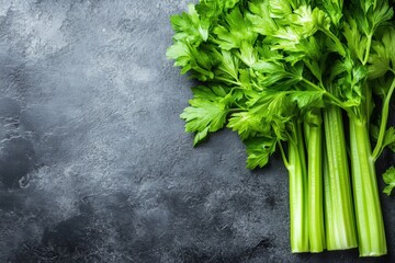 Poster - Fresh green celery stalks arranged on a dark textured surface highlighting natural produce
